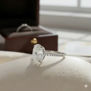 Detailed side profile of the four-prong setting securing the 1 carat oval diamond, emphasizing the craftsmanship.