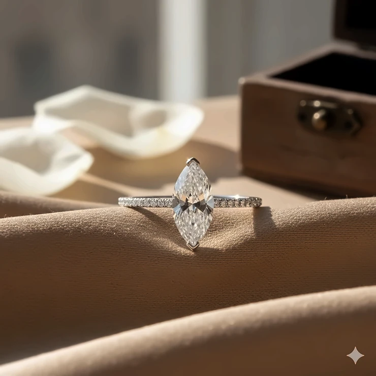 A stunning close-up of a 4 to 5 carat marquise diamond ring set on a thin pavé band, showcasing its elongated shape and brilliant facets.