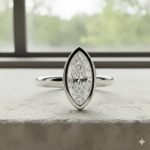 Contemporary and secure bezel-set marquise engagement ring suitable for an active lifestyle.