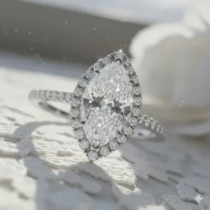 Angled shot focusing on the brilliant pave diamond band and the stunning facets of the central marquise cut diamond.