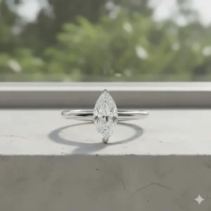 Modern marquise engagement ring set horizontally in an East-West setting on a simple platinum band.