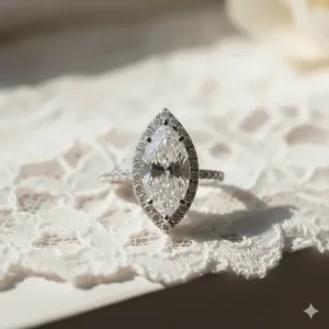 Close-up view of the marquise cut diamond center stone surrounded by a delicate halo setting of smaller diamonds.