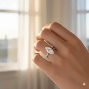 A beautiful shot of a Marquise Diamond Ring worn on a finger, demonstrating the elongating effect of the 1 to 3 carat stone.