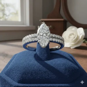 Elegant marquise engagement ring with a brilliant-cut center stone and sparkling pave diamond band.