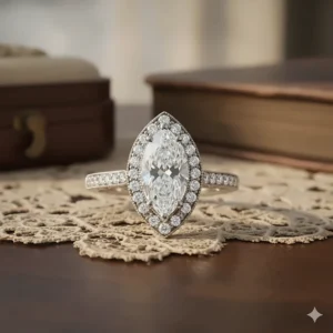 A vintage-inspired Marquise Diamond Ring with a delicate diamond halo, enhancing the sparkle of the 2-carat center stone.