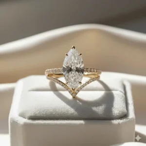 Matched bridal set featuring a yellow gold marquise engagement ring paired seamlessly with a curved diamond wedding band.
