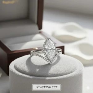 A perfectly matched marquise engagement ring and curved wedding band stacking set.