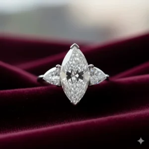 A luxurious three-stone marquise diamond ring, featuring a 4 to 5 carat center stone flanked by two smaller trillion-cut diamonds.