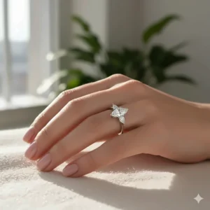 Beautiful shot of a three stone marquise diamond engagement ring worn on a hand.