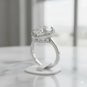 Unique design of a pear halo engagement ring with an extra "hidden halo" detail visible from the side or gallery.