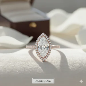Beautiful rose gold marquise halo engagement ring, highlighting the warm metal color and sparkling diamonds.
