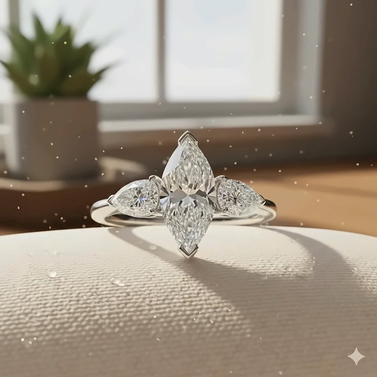 Close-up view of a stunning three stone marquise cut diamond engagement ring set in white gold.