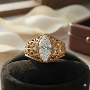 Detailed vintage-inspired marquise engagement ring with intricate milgrain and filigree metalwork.