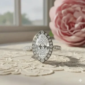 Vintage-inspired marquise halo engagement ring with milgrain detailing on the band and halo for an antique look.