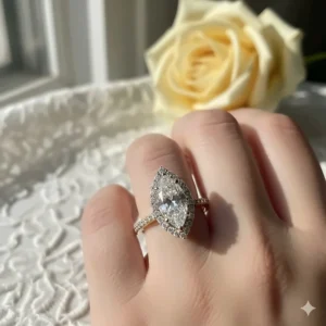 Classic yellow gold band featuring an elegant marquise diamond with a subtle diamond halo for added brilliance.