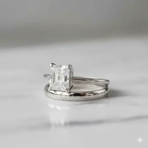 A matched set of an Asscher cut engagement ring and a simple, complementary wedding band, illustrating popular stacking options.