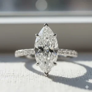 Detailed close-up of a brilliant marquise-cut diamond engagement ring, highlighting the unique facet pattern.