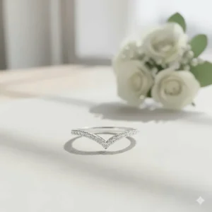 Unique, curved wedding band specifically designed to fit the pointed ends of a marquise engagement ring setting.