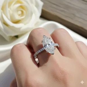 A stunning marquise cut diamond ring featuring a sparkling pavé band for extra glamour and sparkle.