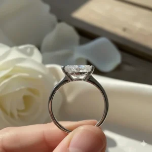 Side view showing the secure V-shaped prongs that protect the delicate points of the marquise cut diamond.