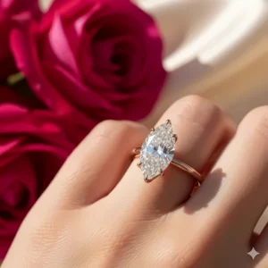 A beautiful marquise diamond ring set in a warm rose gold band, offering a romantic and unique look.
