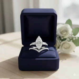 Marquise engagement ring with wedding band presented beautifully in a velvet gift box, ready for a proposal.
