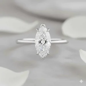 Close-up side view of a marquise solitaire setting, highlighting the V-prongs that secure the elongated diamond for maximum brilliance.
