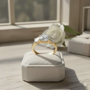 A striking three-stone diamond engagement ring set in warm, luxurious 18k yellow gold.