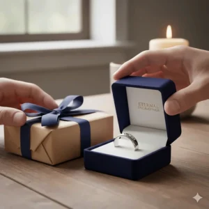 A gift-wrapped box opening to reveal a beautiful bible verse ring engraved with Psalm 23.