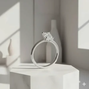 A modern toi et moi engagement ring featuring two offset radiant-cut diamonds on a thin platinum band.