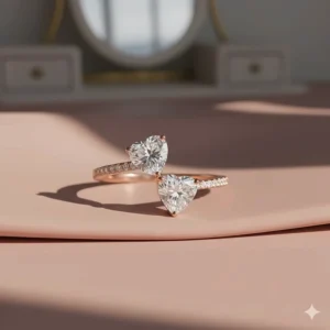 A romantic rose gold toi et moi ring featuring two heart-shaped moissanite stones.