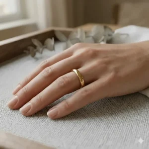 Close-up of a 3mm classic wedding band worn on a ring finger to show proportional fit.