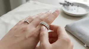 A 6mm wide diamond band worn on a ring finger to demonstrate scale and hand coverage.