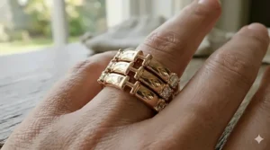 Multiple high polish diamond bands stacked together on a finger for a layered look.