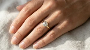 Illustration of a dainty engagement ring for women featuring a round diamond on a simple gold band, showcasing a delicate and timeless aesthetic.