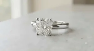 Luxury cushion cut diamond set in a polished platinum band for women.