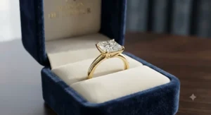 Luxury yellow gold princess cut ring presented inside a velvet ring box