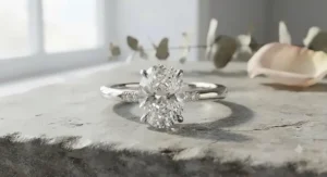 Popular oval-cut diamond engagement ring set on a high-shine white gold band.