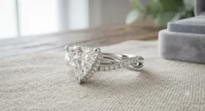 Custom-designed trillion cut engagement ring with a hidden halo and twisted diamond pavé band.