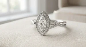 A unique marquise-cut halo engagement ring designed for a flattering, elongated look on the finger.
