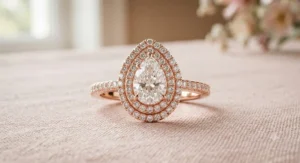 Romantic rose gold pear shaped halo engagement ring with a dazzling double halo design.