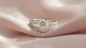 A sparkling diamond solitaire styled with custom curved wedding bands for curved engagement rings.