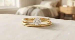 A discounted bridal ring set under $300 crafted in warm yellow gold plating with a timeless solitaire diamond alternative.